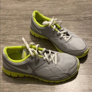 Grey and neon yellow Nike sneakers
